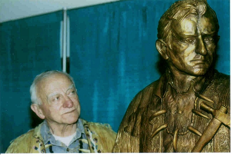 Wilbur Ternyik posed with bronze at Florence Events Center on April 13 th . Elected officials and citizens recognized Wilbur for his 40 years of community service including 16 years as City Councilman, including 6 years as Mayor, and 29 years as commissioner for the Port of Siuslaw.