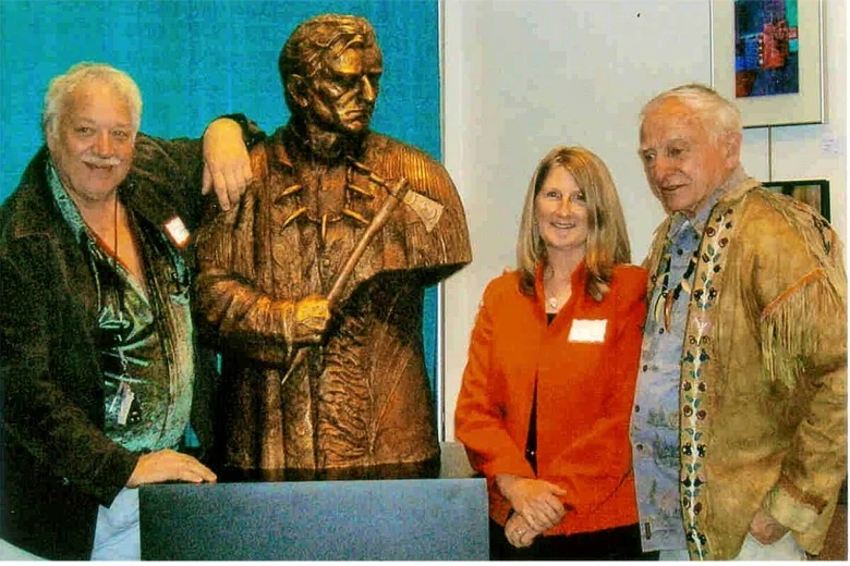 Sculptor Lorenzo Ghiglieri and Kathy Bridges from the Bridges Foundation present the bronze to Wilbur Ternyik at a Florence celebration held in April. The bronze will be permanently mounted on 120-year old Douglas fir pedestal at its final destination, Gateway to Discovery north of Seaside. 