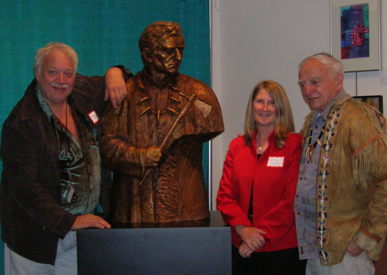 Wilbur E. Ternyik (right) honored in Florence, OR Lorenzo E. Ghiglieri, artist, presenting bronze with Kathy Bridges, The Bridges Foundation