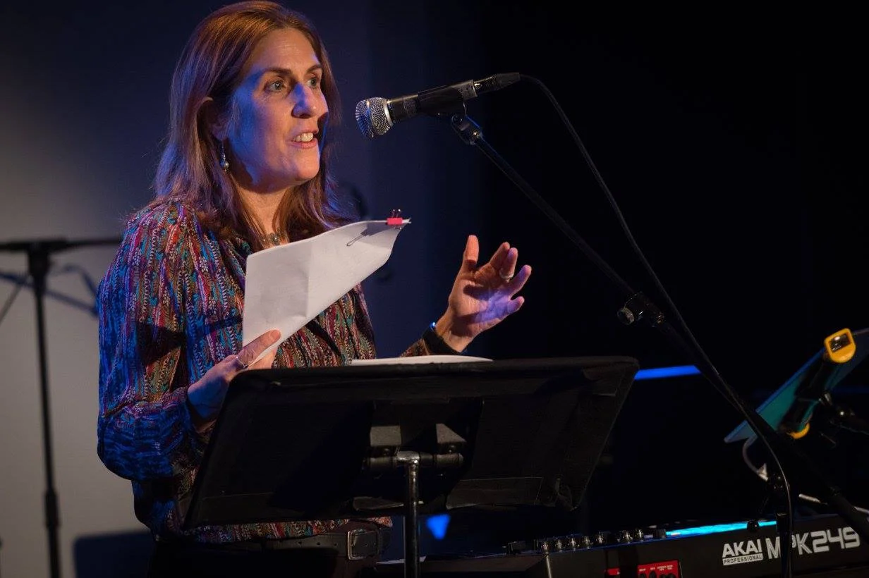 Mia MacDonald of Brighter Green and co-vice president of the Culture & Animals Foundation introduces the acts at the Compassion Arts & Culture and Animals Festival , October 22, 2017. Photo by Jo-Anne McArthur