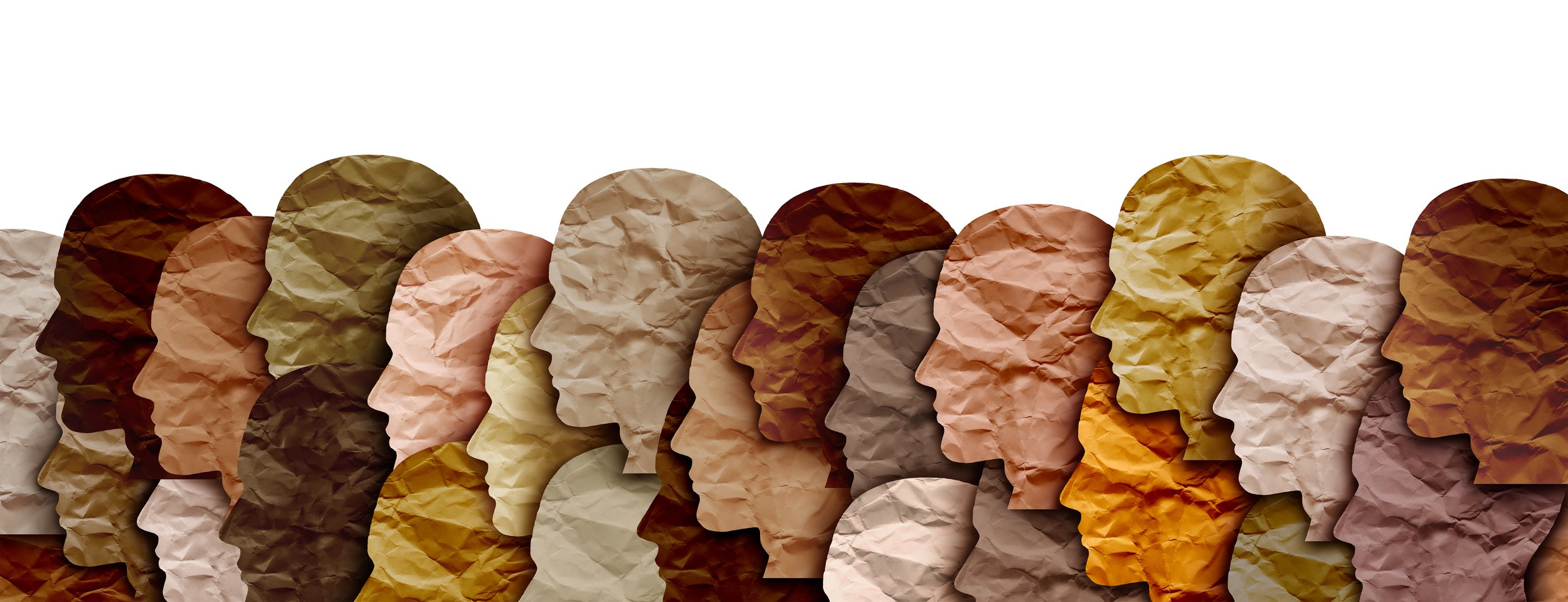 Multi-colored human head profiles make out of paper.
