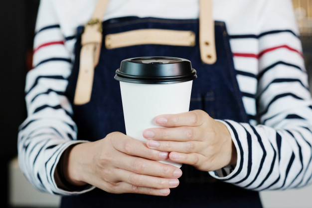 barista-holds-take-away-coffee-cup_7190-1138.jpg