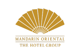 Logo for Mandarin Oriental Hotel Group featuring a gold fan design and black background.