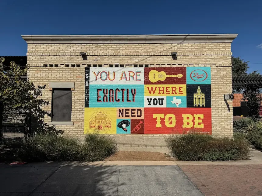 Colourful mural on a heritage building wall.