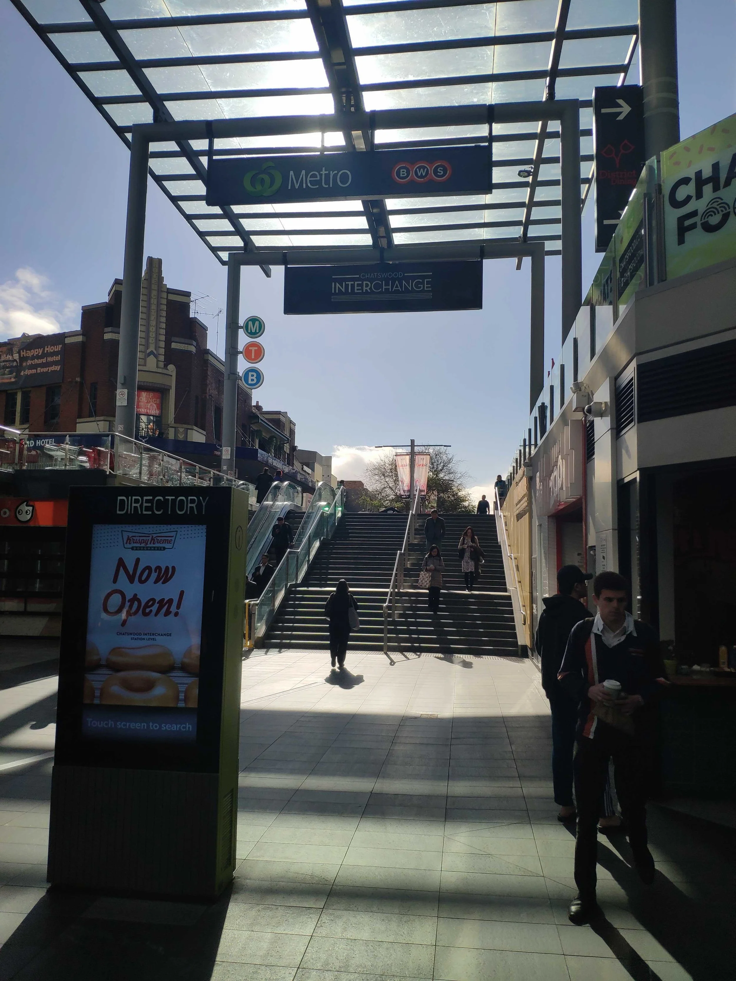 You will see a flight of stairs and escalators on your right. Please go up.
