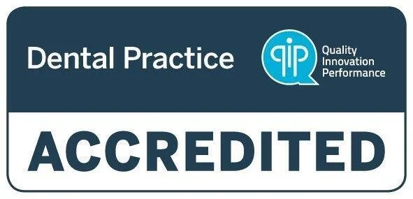Sign for a dental practice indicating accreditation and quality standards.