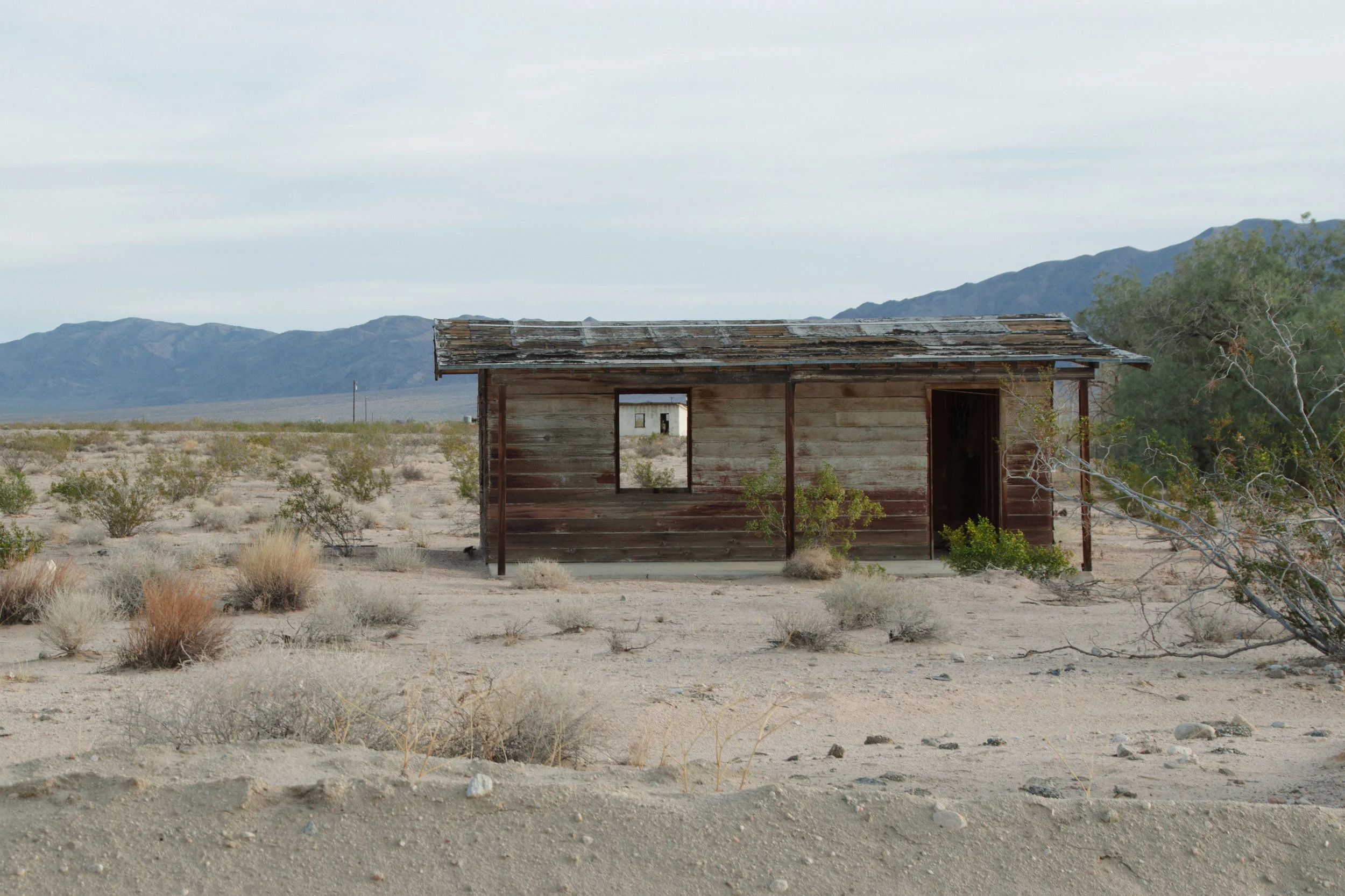 In 1938 the Small Tract Act leased small parcels of Southern California desert to homebuyers as a means to increase home ownership and spur the economy. However, due to poor planning and limited infrastructure, most of the homes were eventually abandoned. These structures are found just outside Amboy, CA.