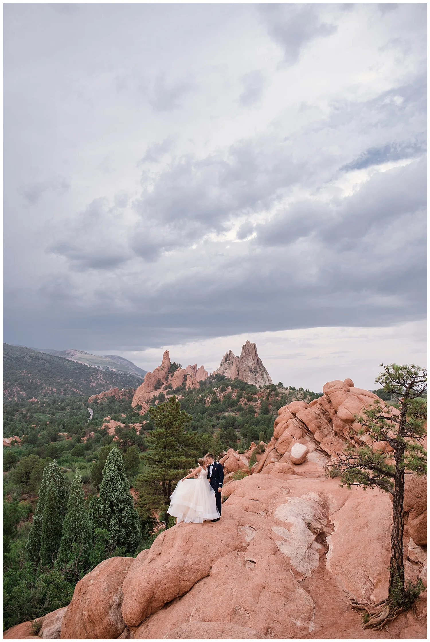 Military Wedding, bride and groom, navy suit groom, dress blues groom, bridal party, romantic portraits at garden of the gods, bride and groom at garden of the gods, Colorado Wedding Photographer, Denver Wedding Photographer, Denver Elopement Photographer, Colorado Elopement Photographer, Rocky Mountain Wedding Photographer, Downtown Denver Photographer,