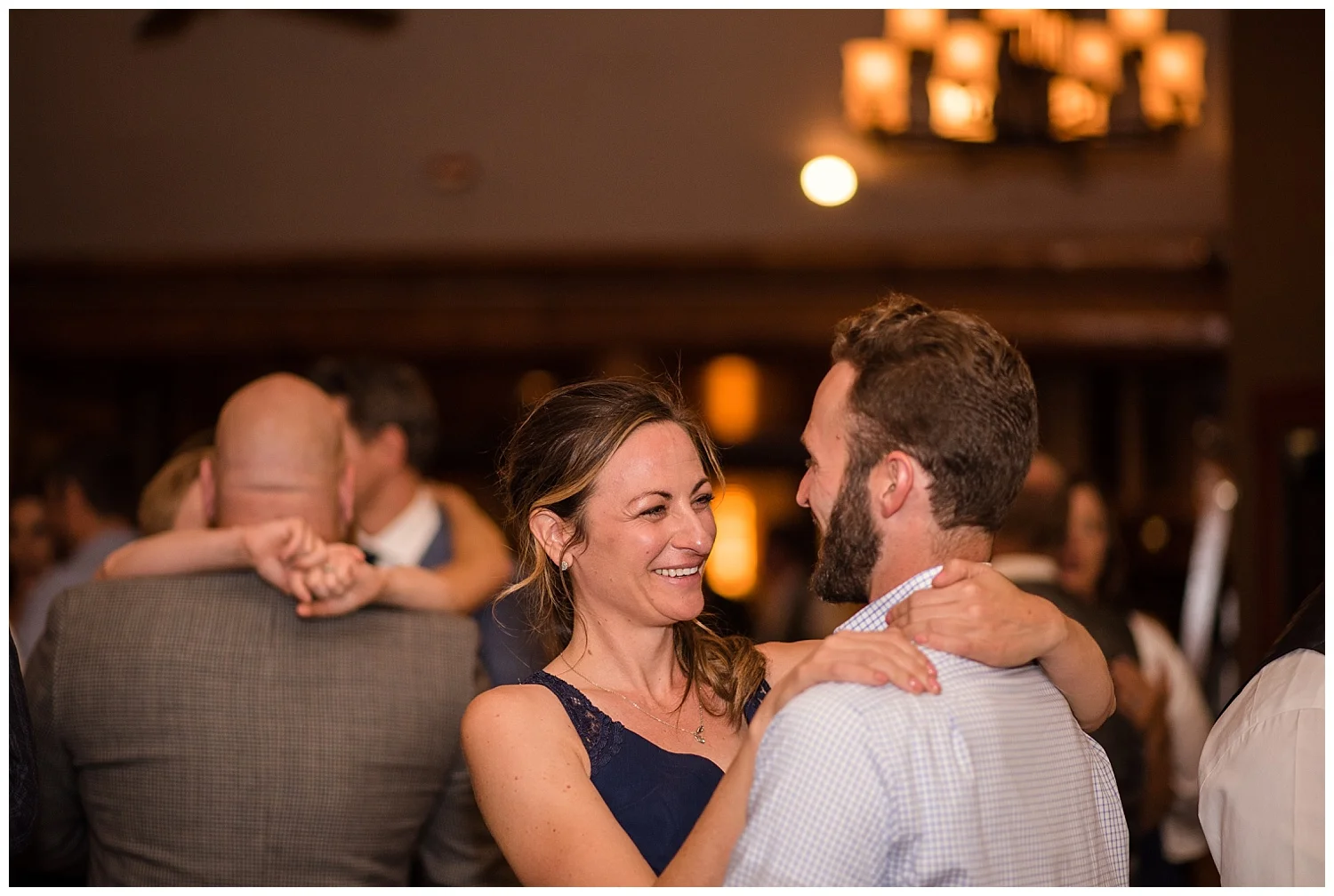 wedding guests dancing at estes park resort, rocky mountain elopement photographer, rocky mountain wedding photographer, colorado wedding photographer, Estes Park wedding photographer
