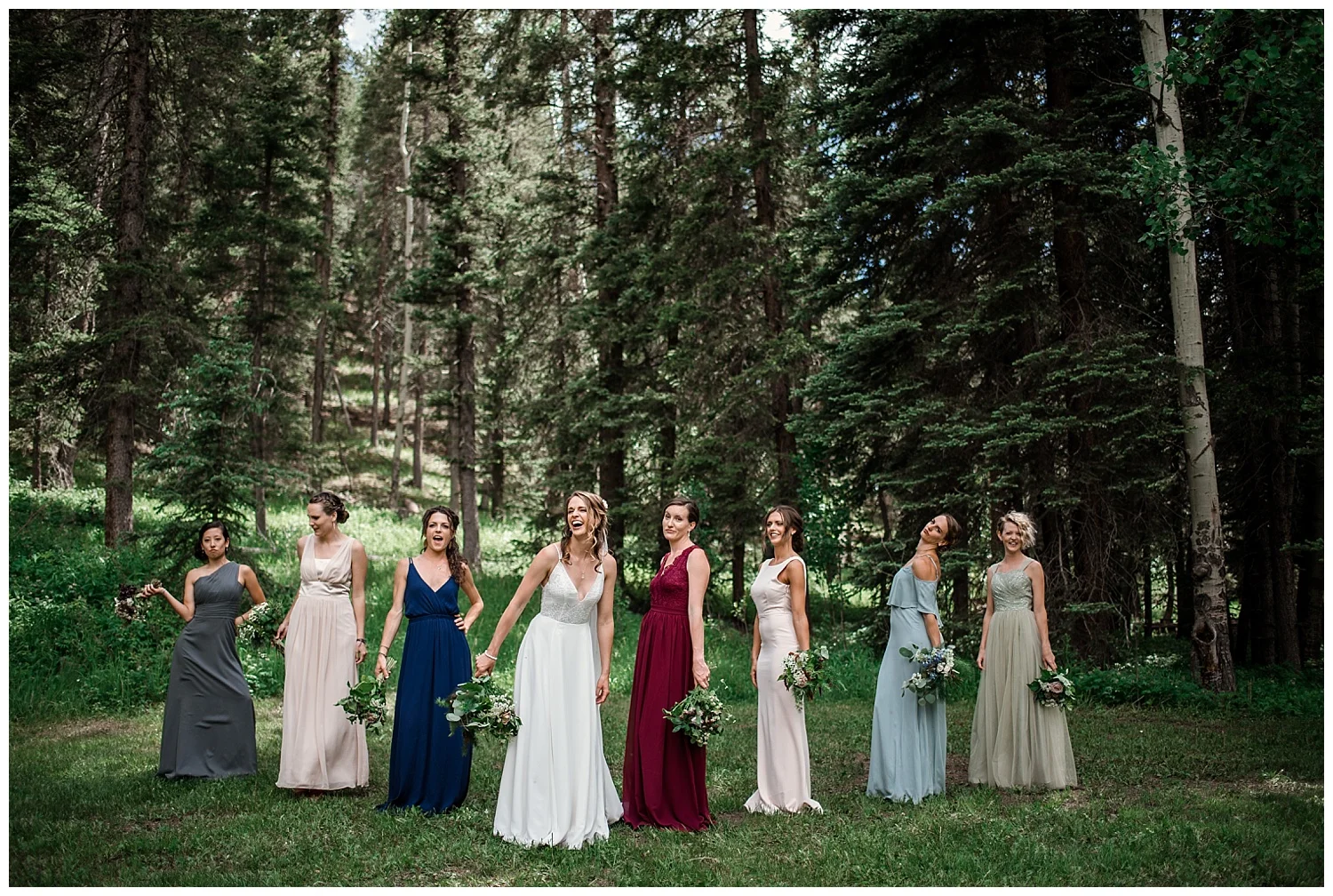 wedding party portraits at Beaver Ranch in Conifer Colorado, Colorado Wedding Photographer, Rocky Mountain Wedding Photographer, Intimate Colorado Wedding Photographer, bridesmaids laughing in jewel toned dresses