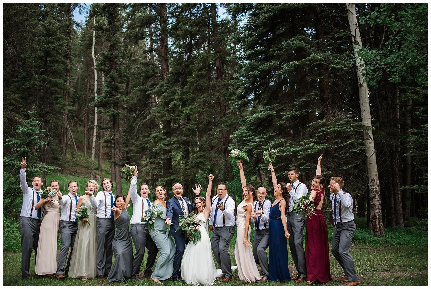 wedding party portraits at Beaver Ranch in Conifer Colorado, Colorado Wedding Photographer, Rocky Mountain Wedding Photographer, Intimate Colorado Wedding Photographer, bridesmaids laughing in jewel toned dresses
