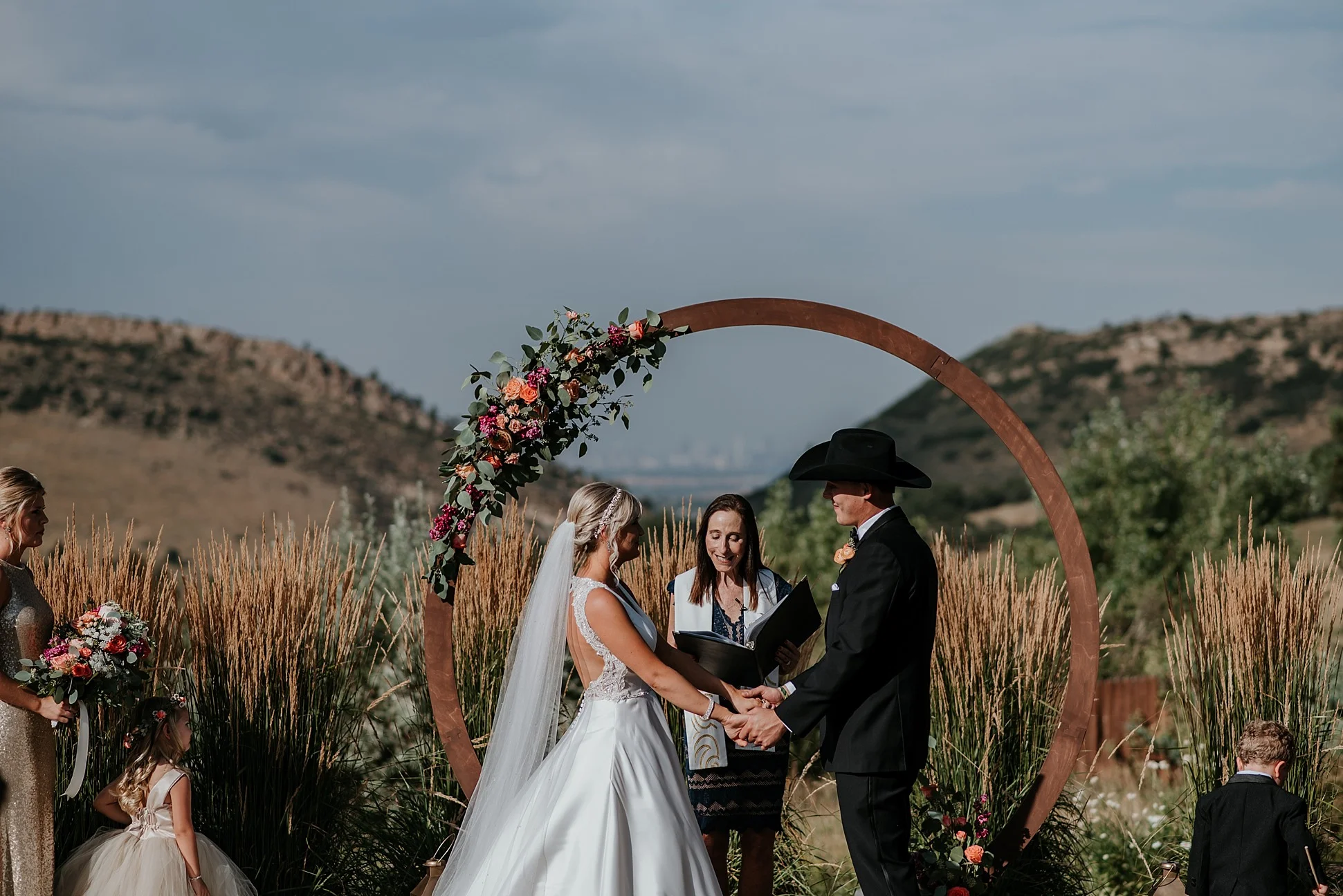 The manor house wedding, the manor house wedding photographer, denver wedding photographer, colorado elopement photographer, colorado wedding photographer, denver wedding videographer, colorado wedding videographer, denver wedding photographer and videographer, floral arch ceremony