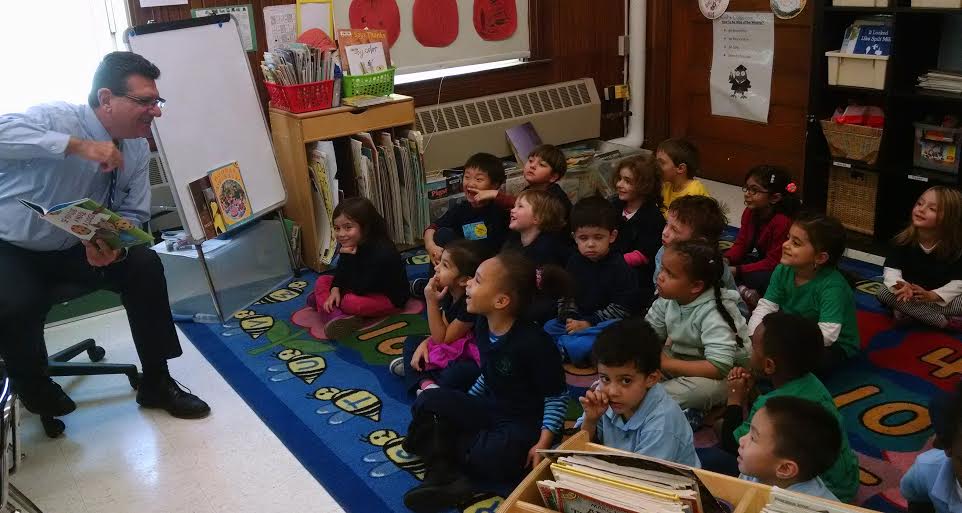 Ciommo reads If You Give a Mouse a Cookie to a 1st grade class at the Winship School.