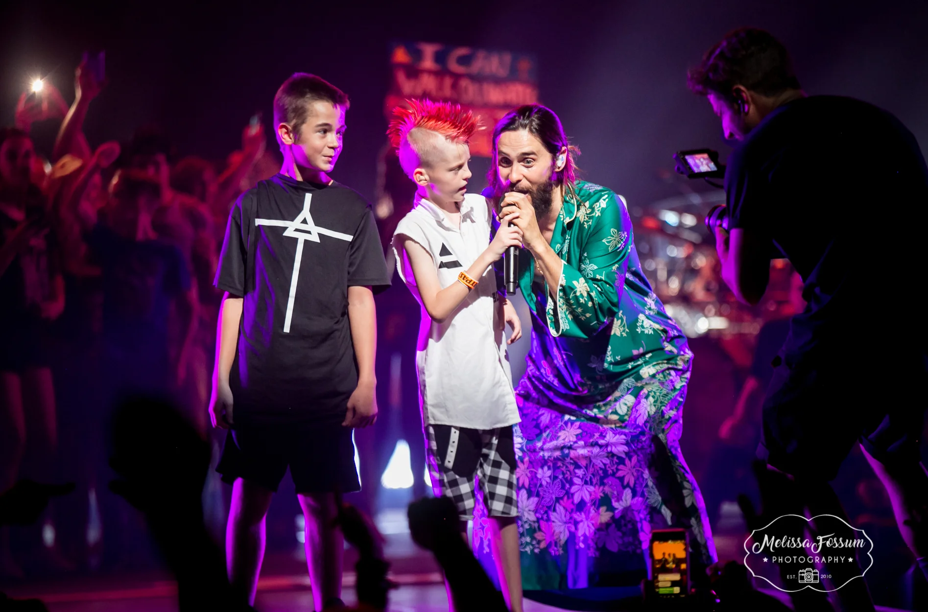 Jared Leto brings a couple young fans on stage to sing.