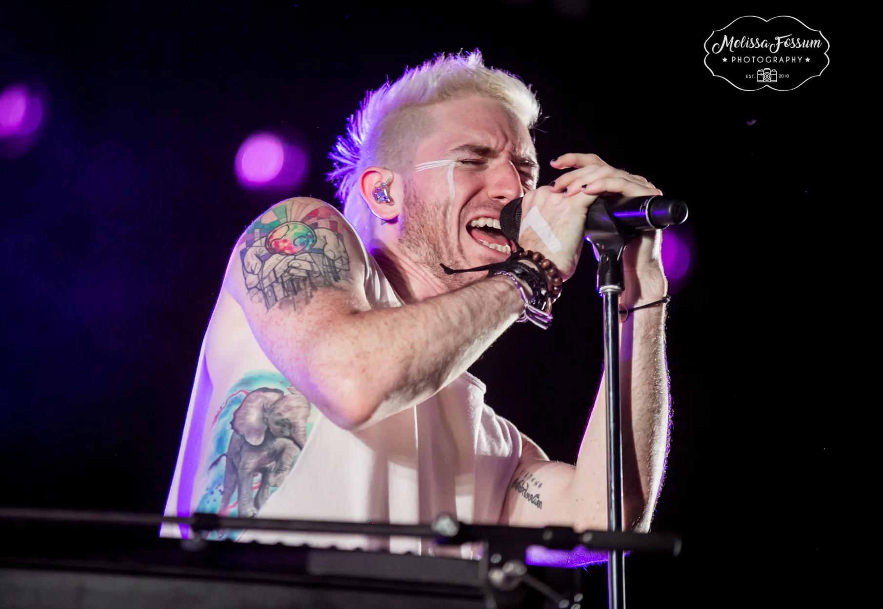 Nicholas Petricca shows off his colorful tattoos.