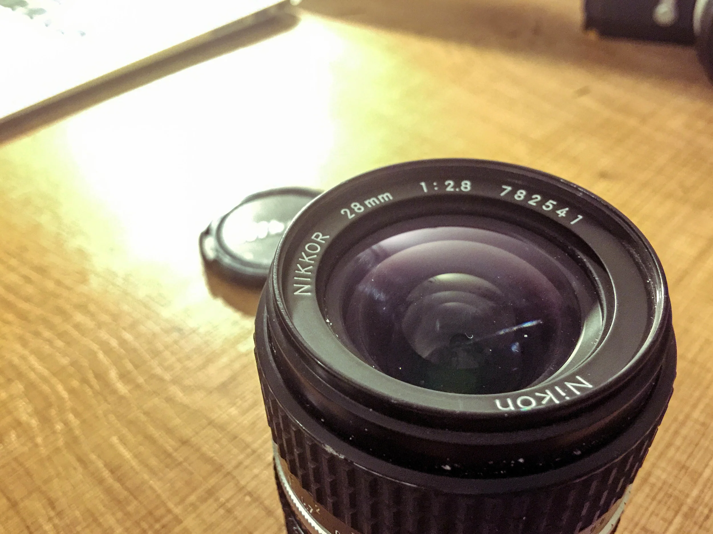 Nikon Nikkor AIS 28mm F2.8 One of the best Nikon manual lenses ever! Could easily be found on eBay, but I had an amazing deal when I purchased this: a fully functional Nikon Nikkormat film camera body, Nikkor SC 50 f1.4, and this lens for $250 AUD. Get it here