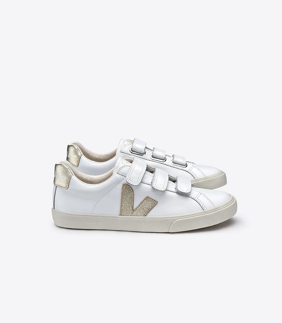 Veja gold velcro sneakers. I'm a big fan of this sustainable French sneaker brand. Warning: it takes a bit to break them in, but after a few wears they're extremely comfortable. 