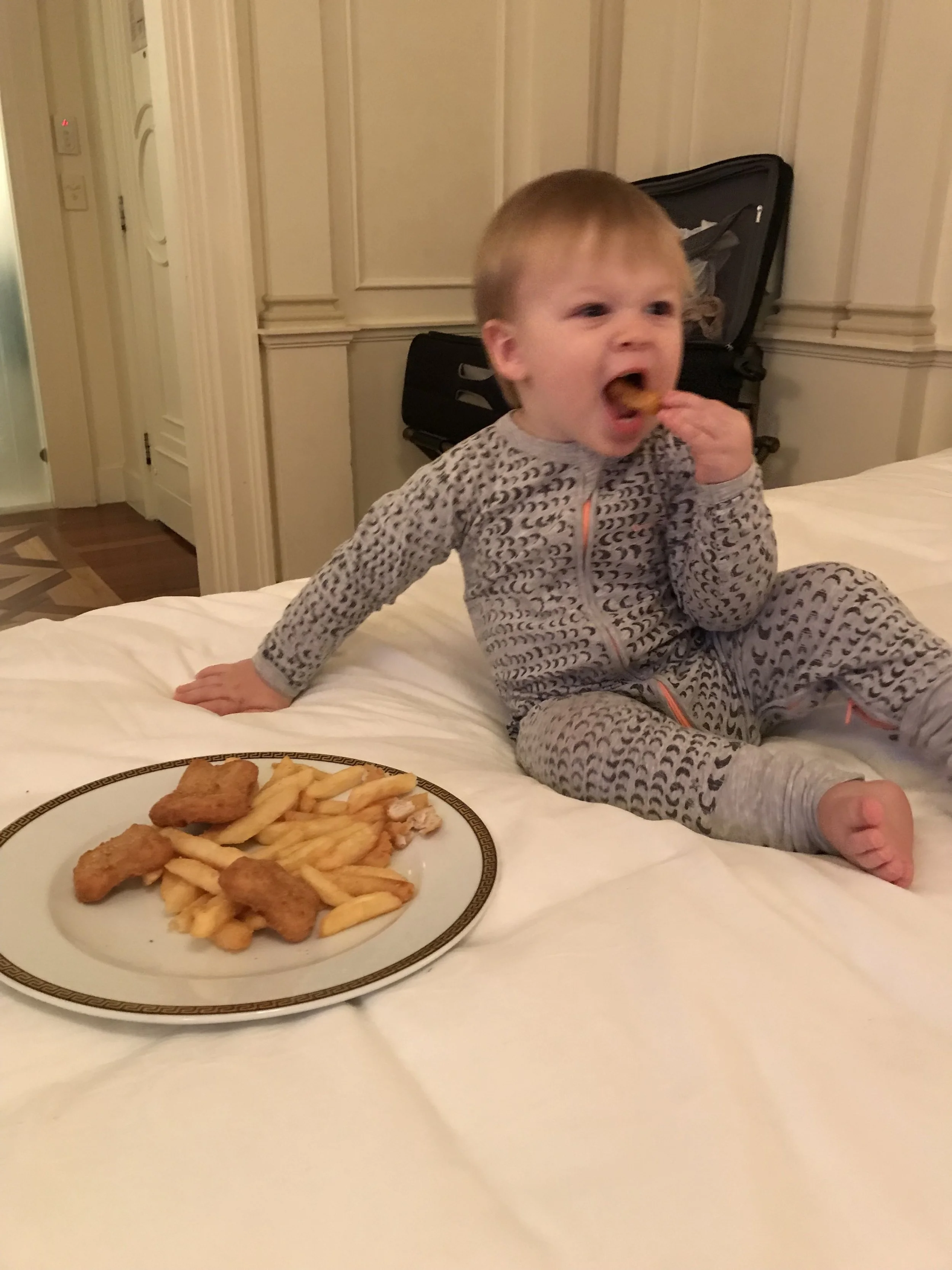 Living his Best Life: chicken nuggets and chips in bed!