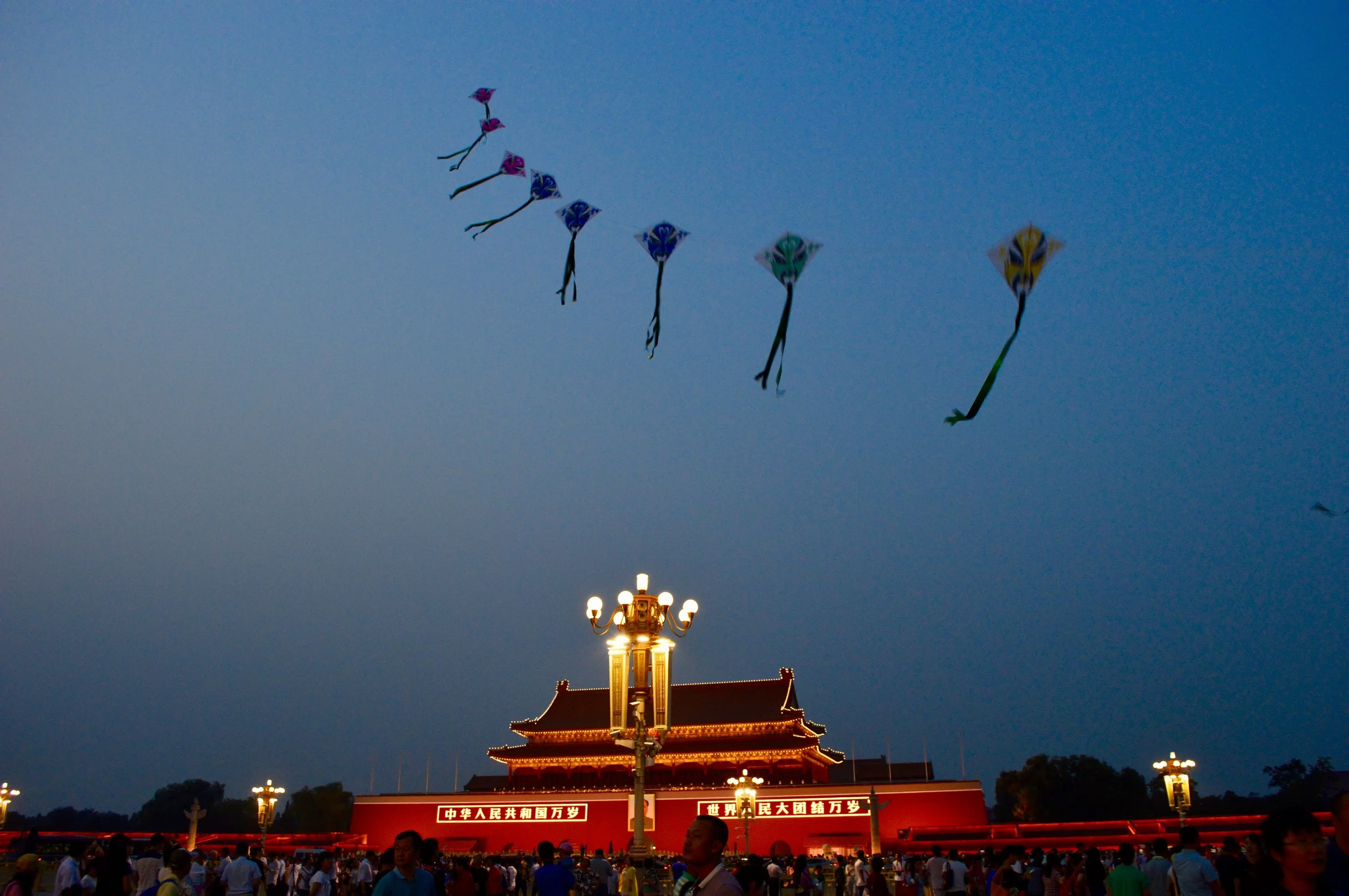 Kites and lights after flag lowering ceremony at entrance to Forbidden City, Beijing.