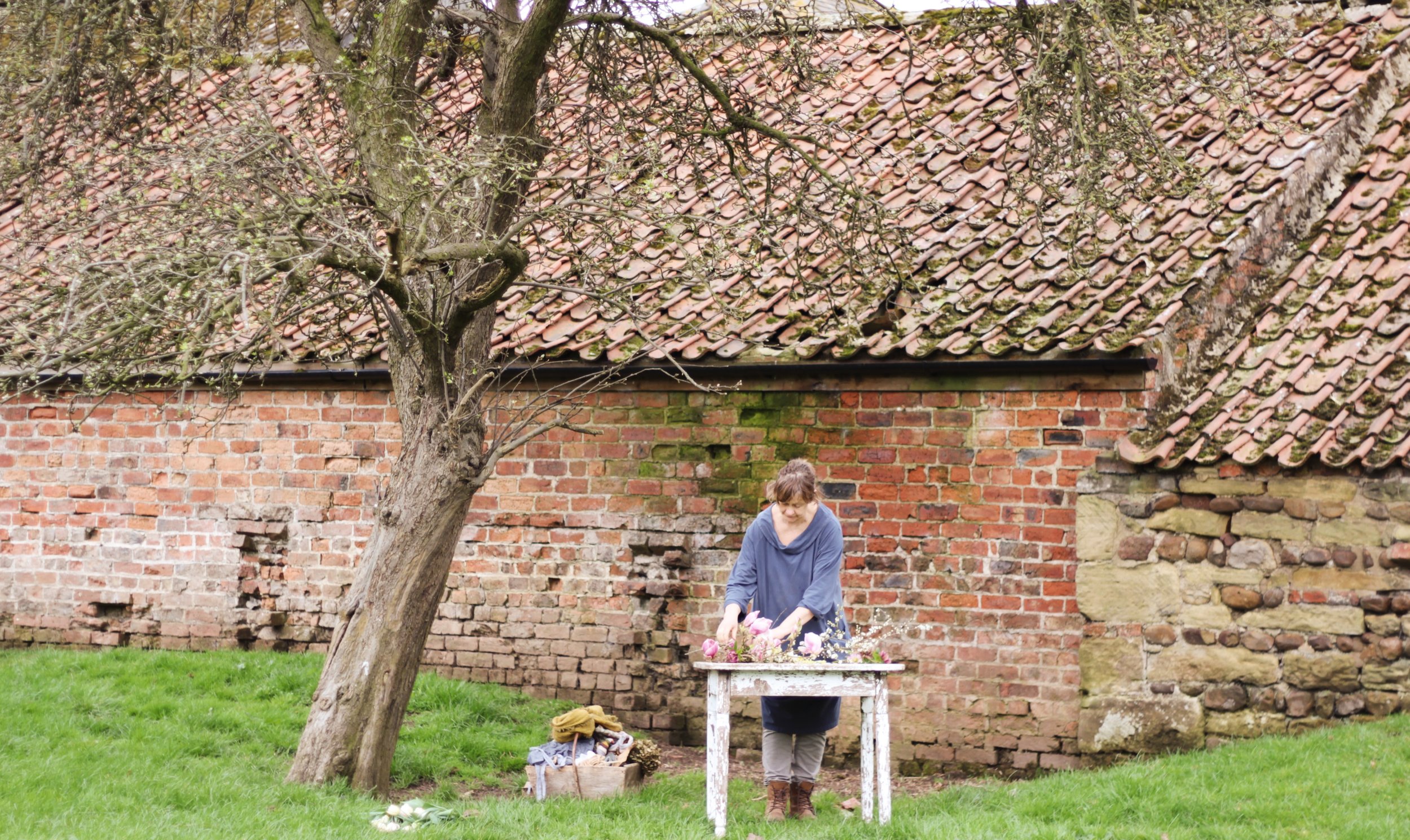 Fiona Pickles in the orchard at Holme Flowers