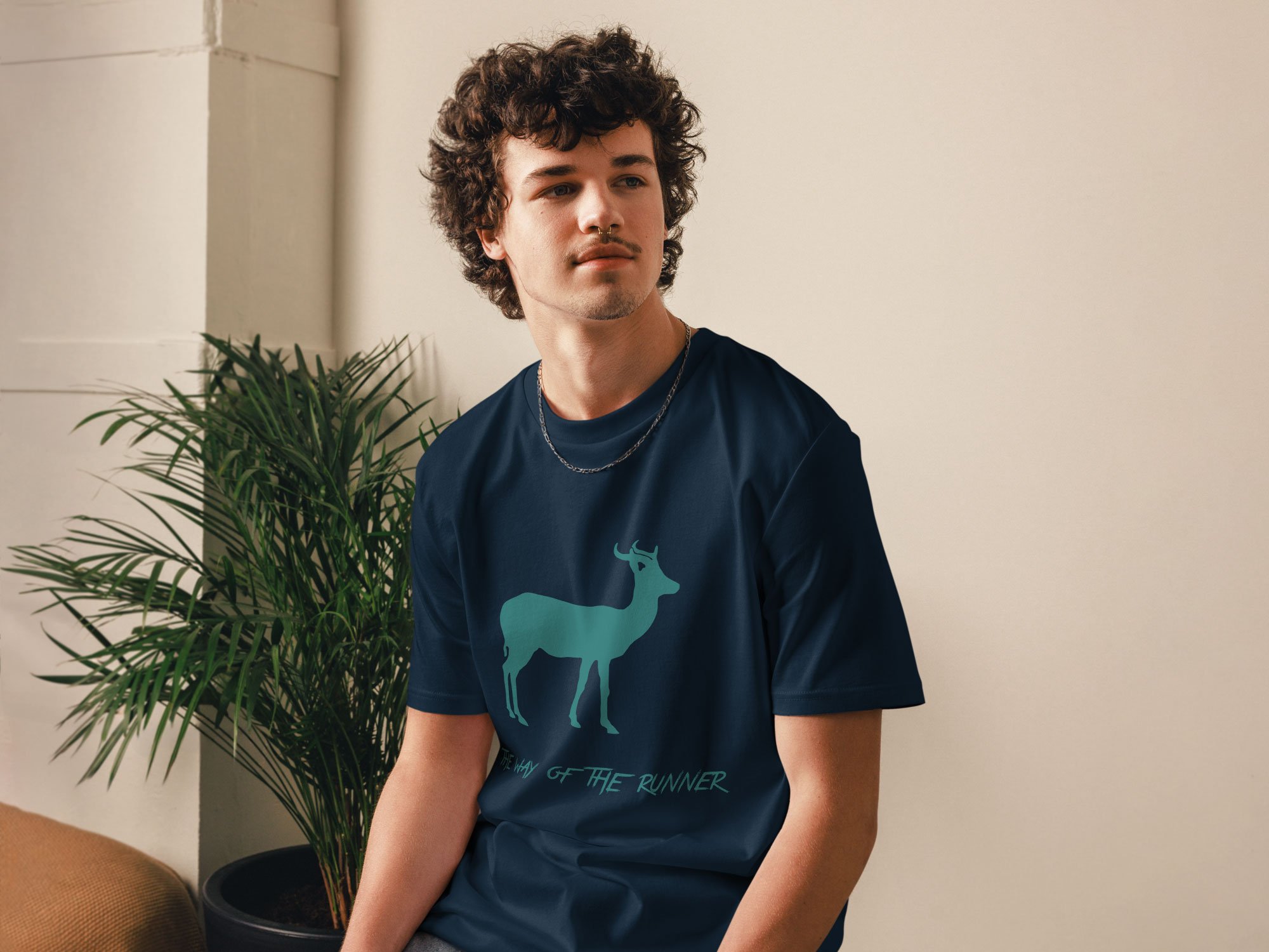 a model wearing a unisex organic cotton t-shirt in french navy