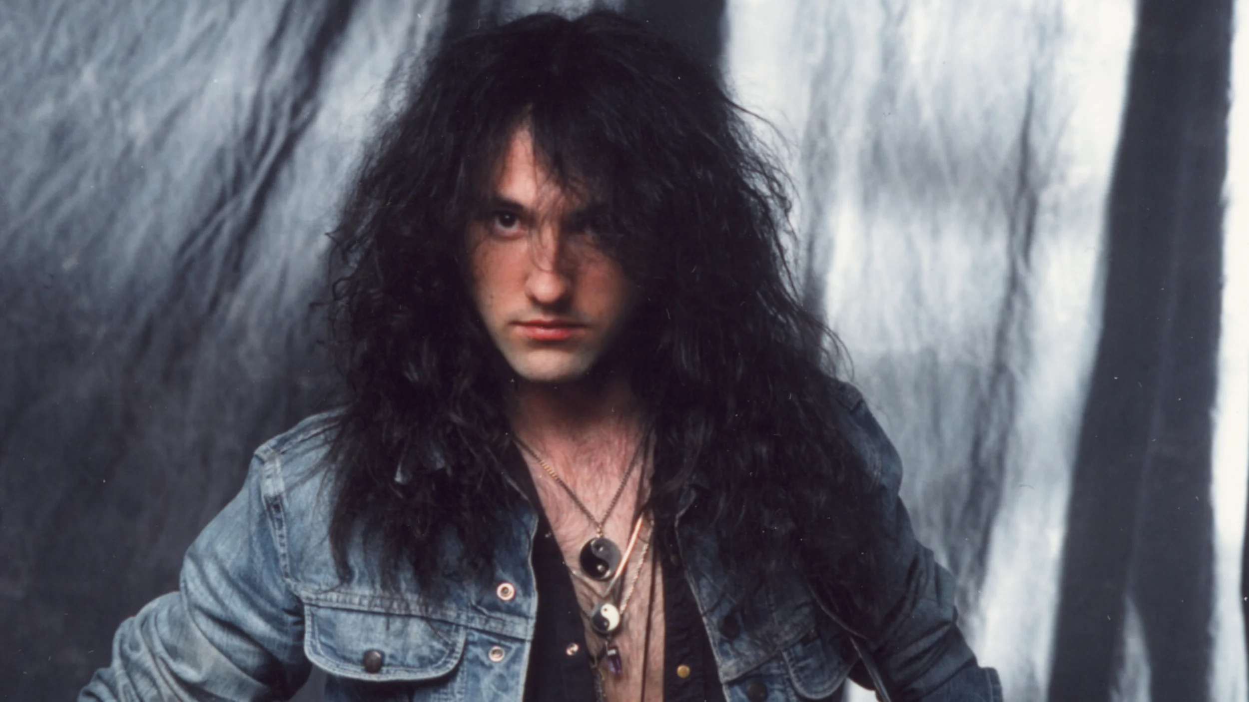 Jason Becker Not Dead Yet Jason posing with guitar Dogwoof.jpg