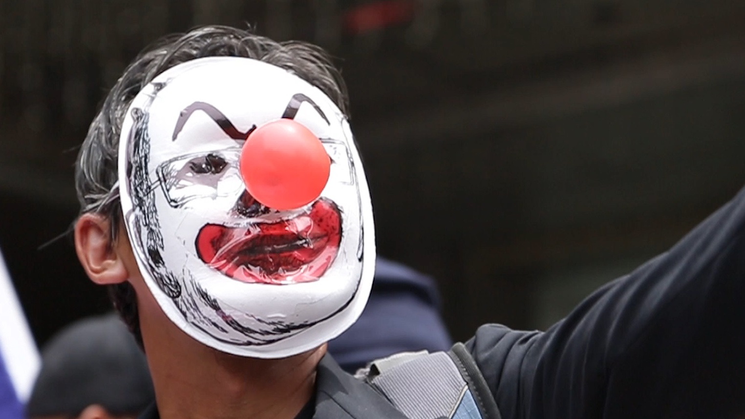 Kelptocrats_DogWoof_02.39_Clown Faced Protester_903977.jpg