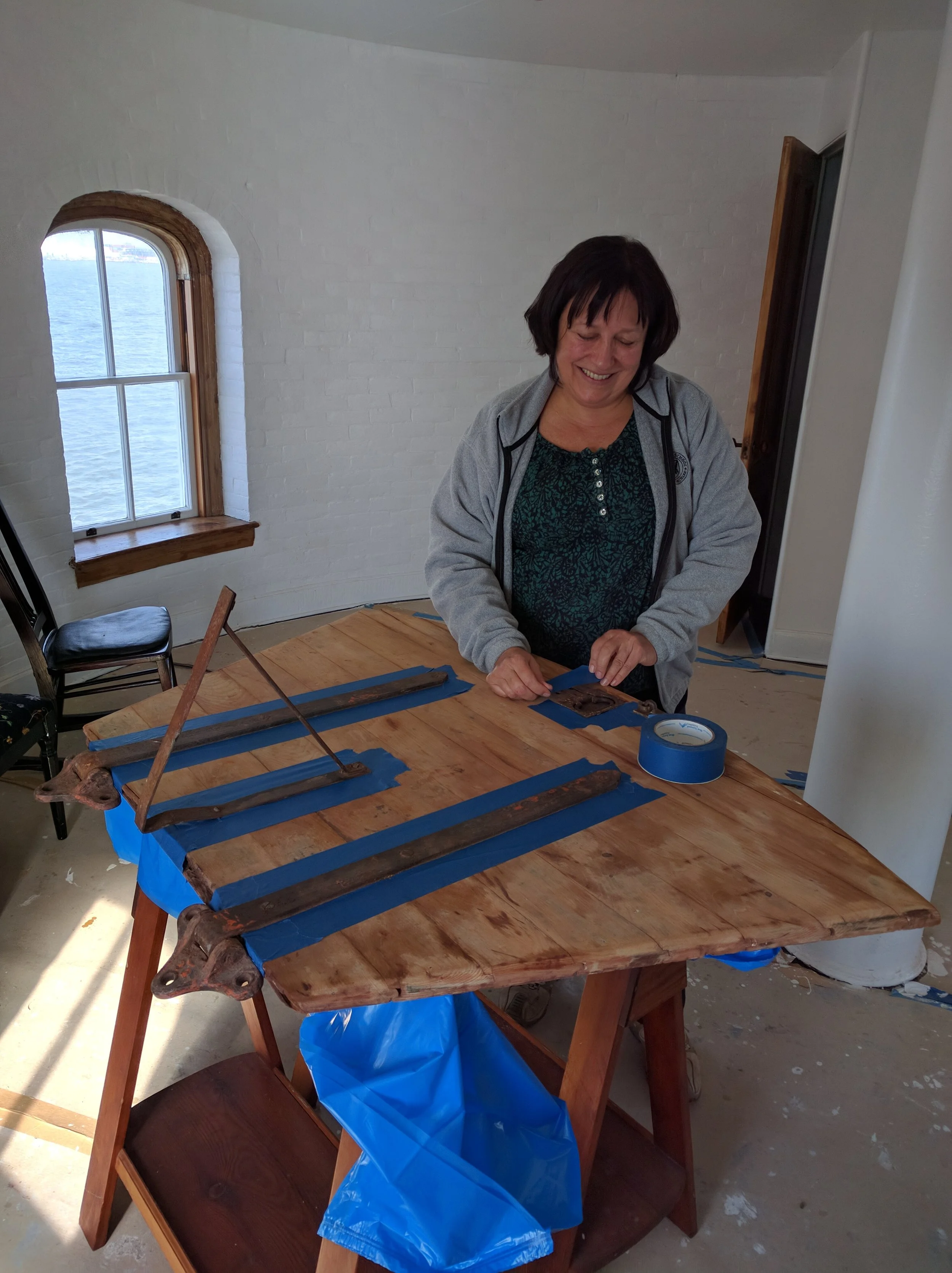 Leslie working on the Watch Gallery hatch cover.