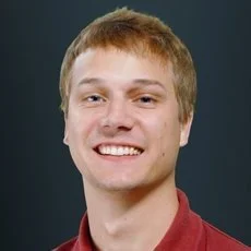 Headshot of Justin Mandrup-Poulsen