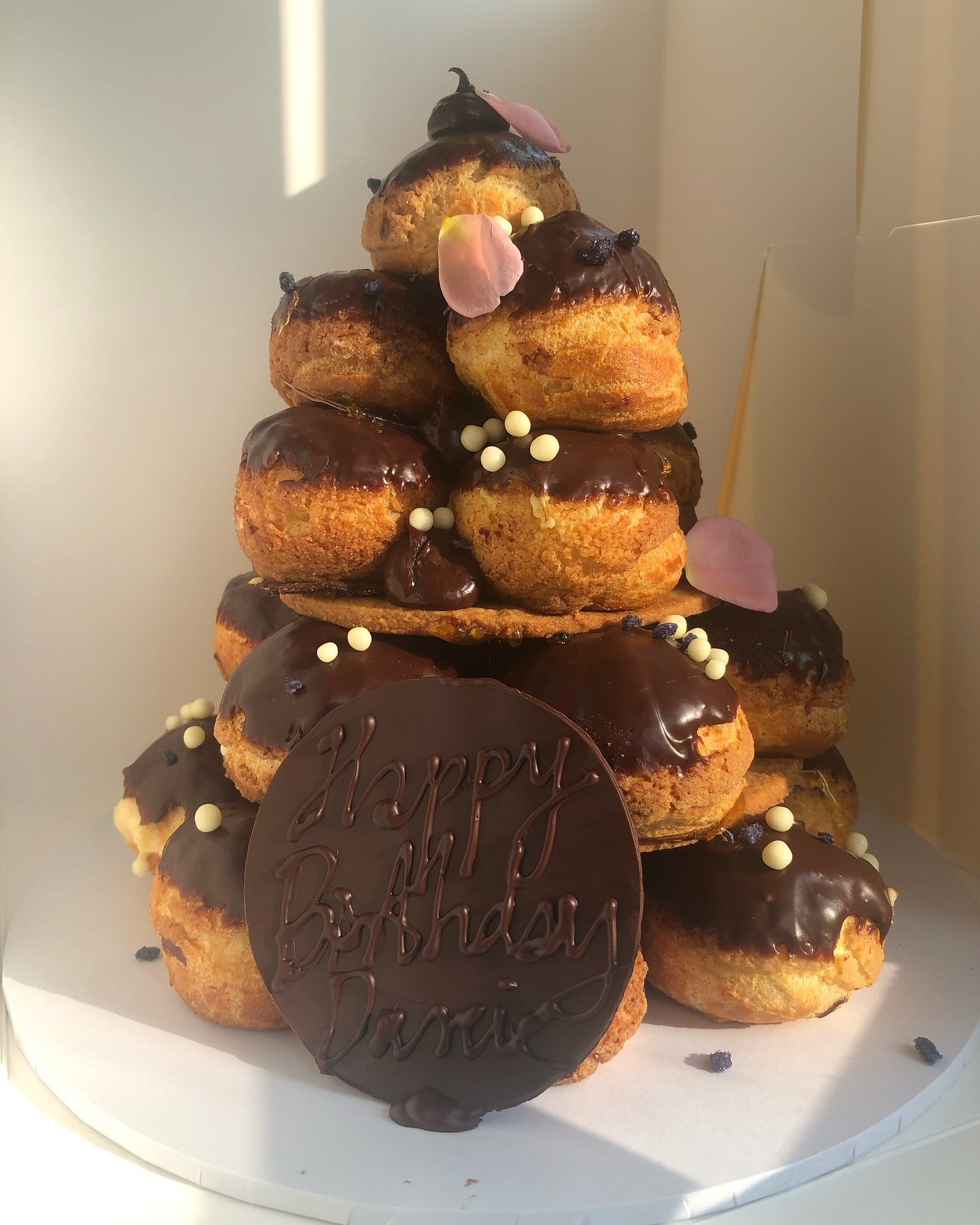 Profiterole style choux tower i made last week. 

All cakes, bakes, towers made in house. We have a tiny space, where we sell coffee, lose leaf tea and savoury bites too. Cakes made to order.

We are at Fairfax corner, 26 Fairfax street yo1 6eb, just