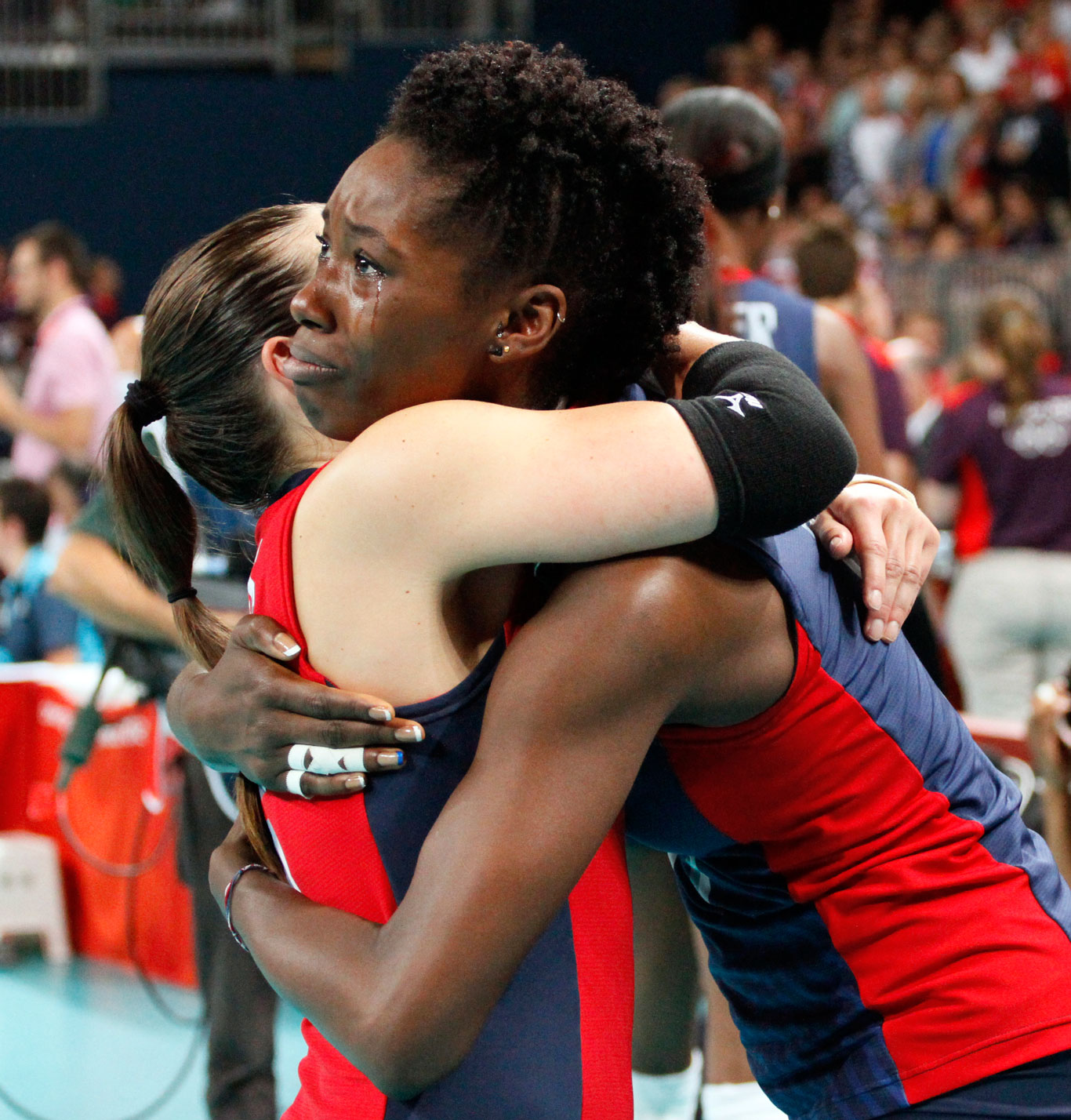 U.S. volleyball player Megan Hodge has tears as she hugs Nicole Davis after winning a silver medal at the London Olympics. 