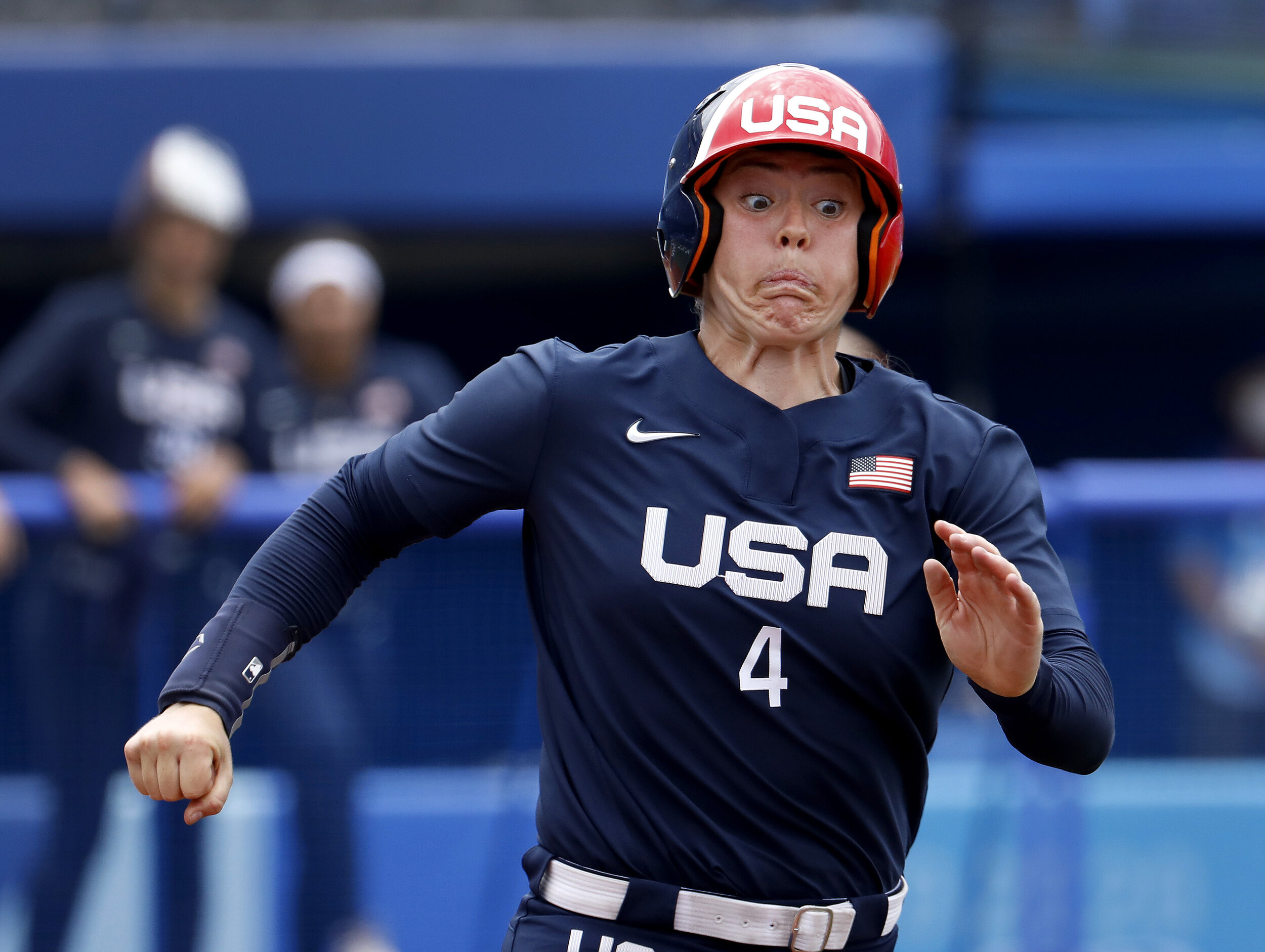  U.S. softball player Amanda Chidester strains as she heads to first base against Japan during the Tokyo Olympics. 
