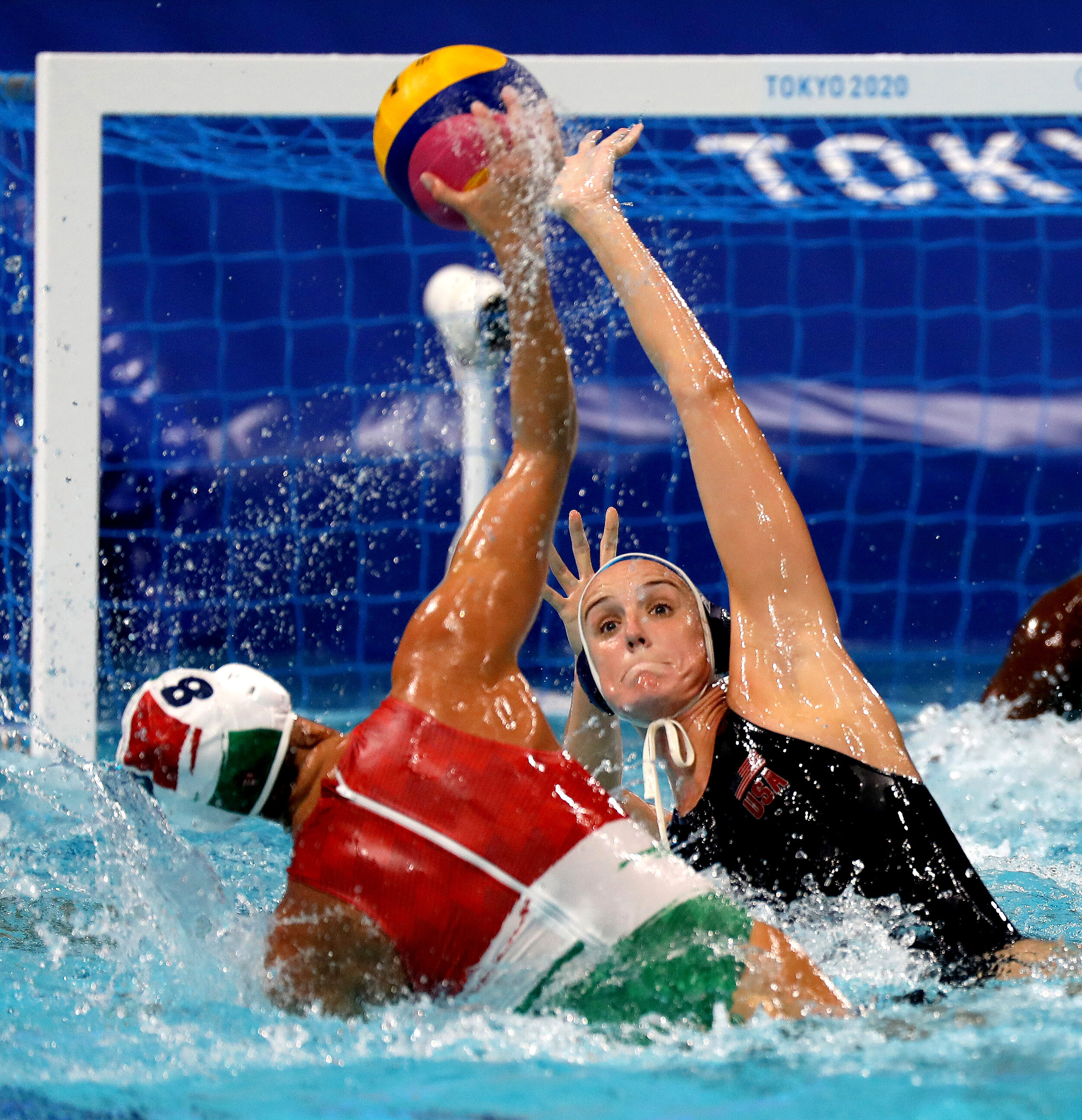  U.S. water polo player Makenzine Fischer blocks Rita Keszthelyi from Hungary at the Tokyo Olympics. 