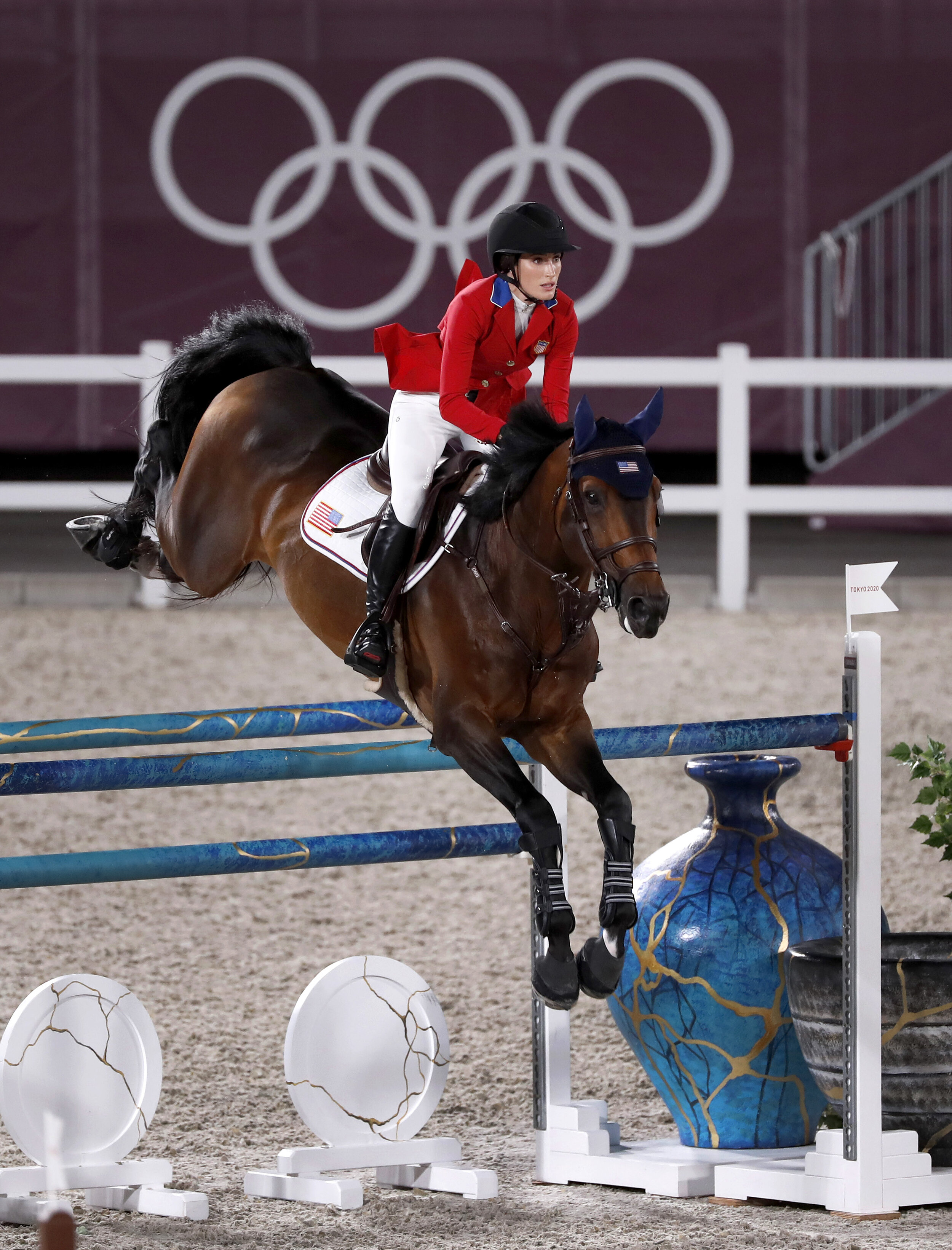  Jessica Springsteen clears a gate with her horse Don Juan Van De Donkhoeve at the Tokyo Olympics. 