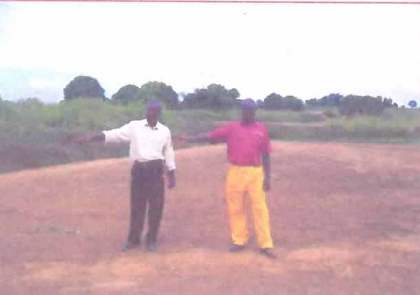 Pastor and colleague at building site