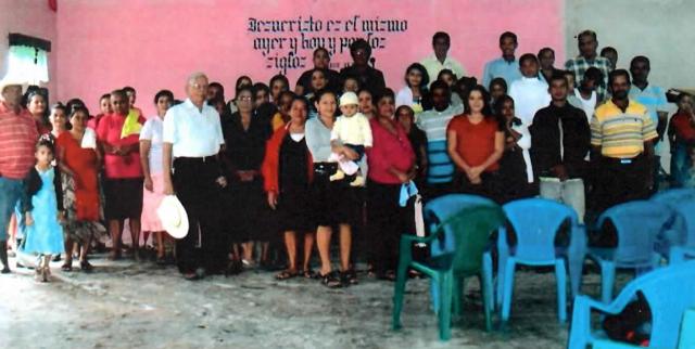 Congregation worshiping before construction