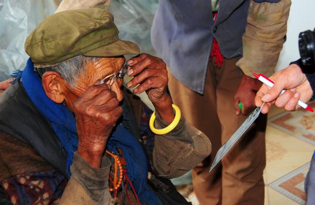 Local elderly lady receiving much needed eye glasses