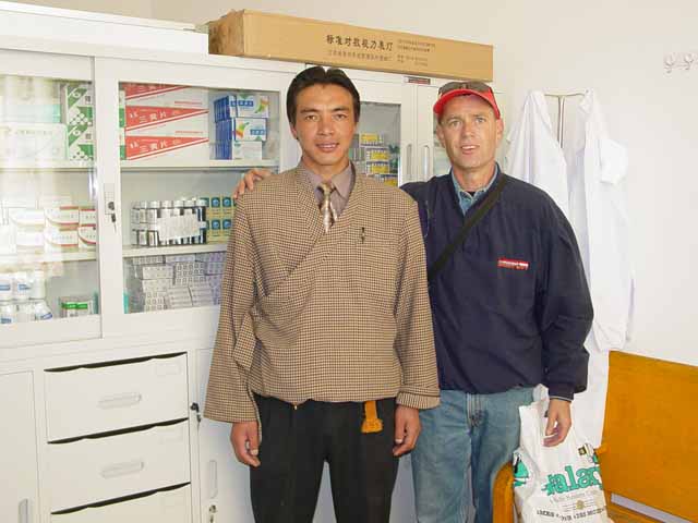 Scott with the school's principal in the clinic