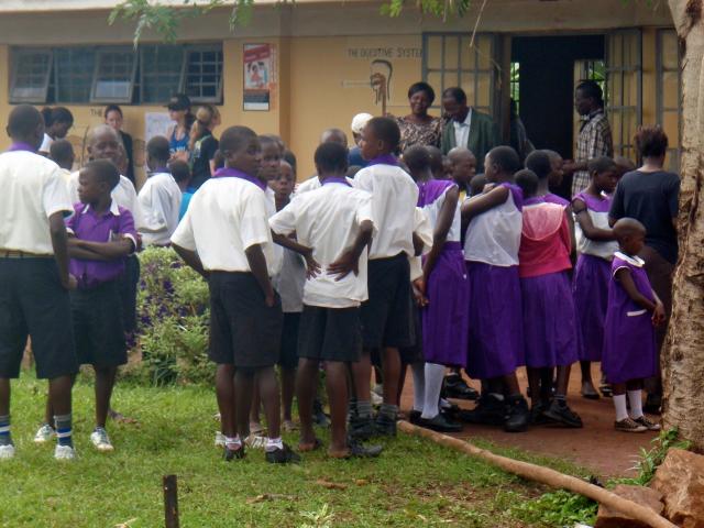 School children in Kasawo looking at medical clinic designs