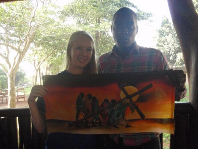 Godfrey Kalungi with artwork (& Emily Raecker)