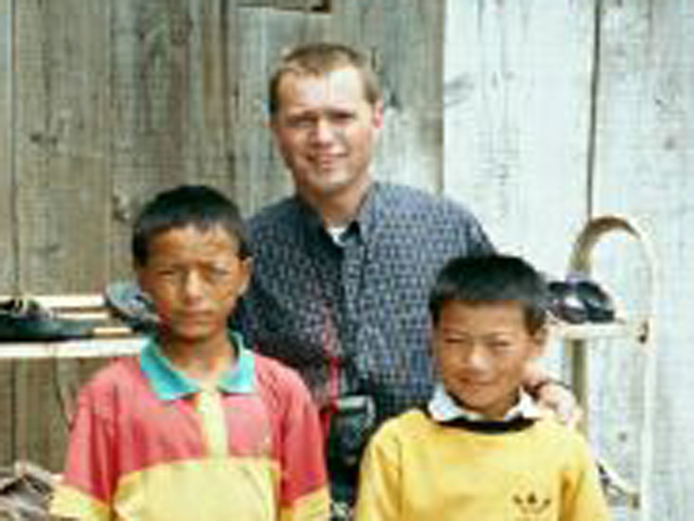 Scott with village children