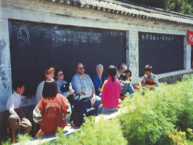 Group with children at LiJiang Orphanage