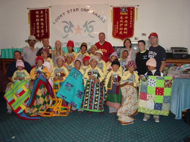 Group quilts and hats at Tibetan orphanage