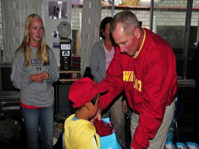Handing out school supplies to each of the children at Tibetan orphanage