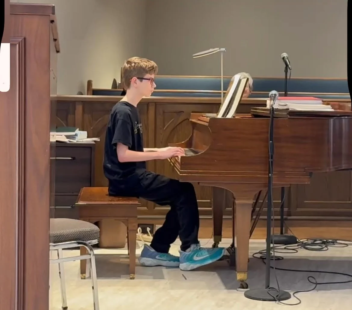 Maddox Borders Whaley playing piano during service.jpg