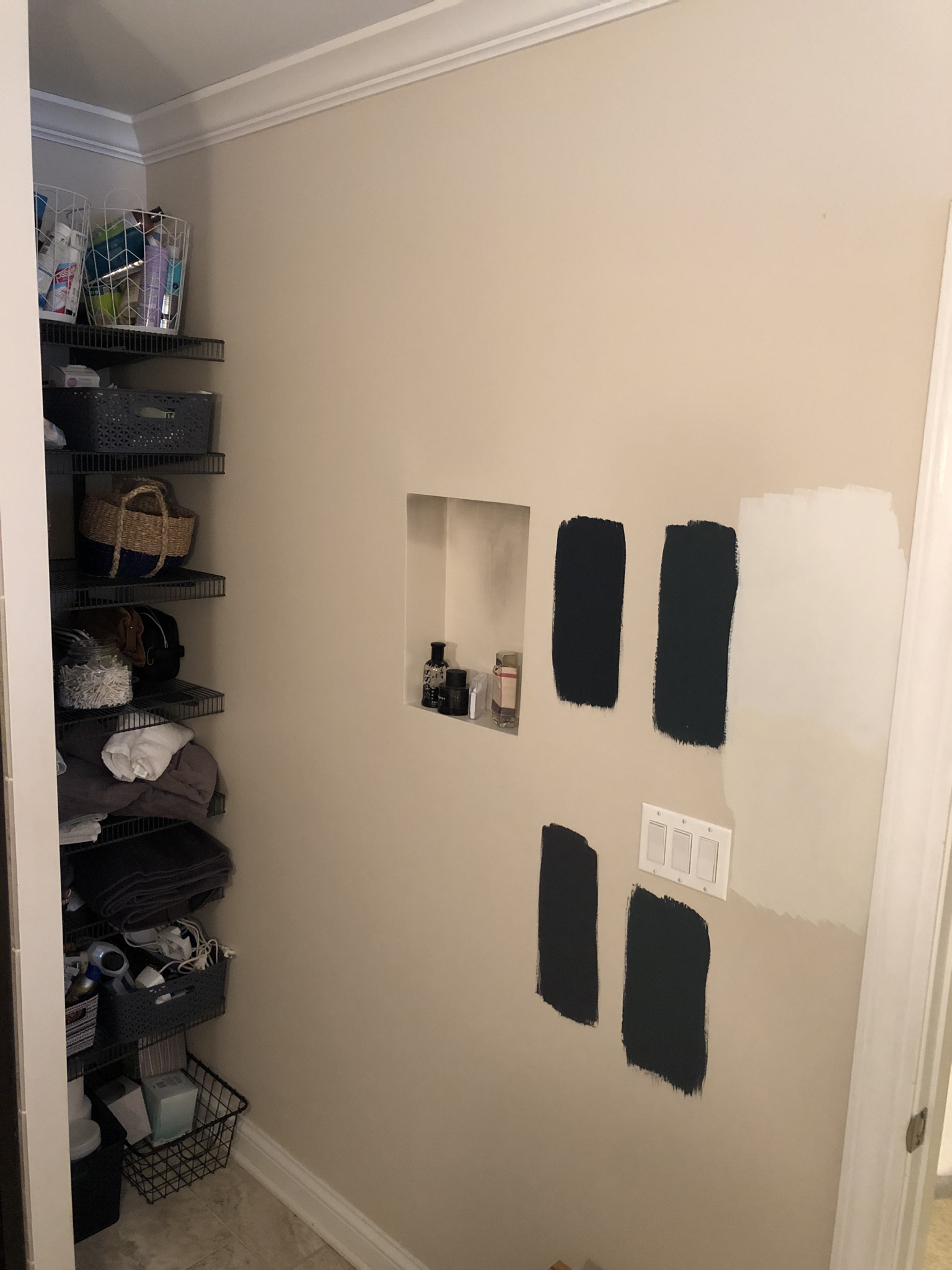 Here are the paint samples I tested almost two years ago! When we painted our upstairs bathroom, I thought I might be resourceful with the dark paint in here too, but it was just too dark in the basement. We ultimately used the same white paint color we used for the nursery.