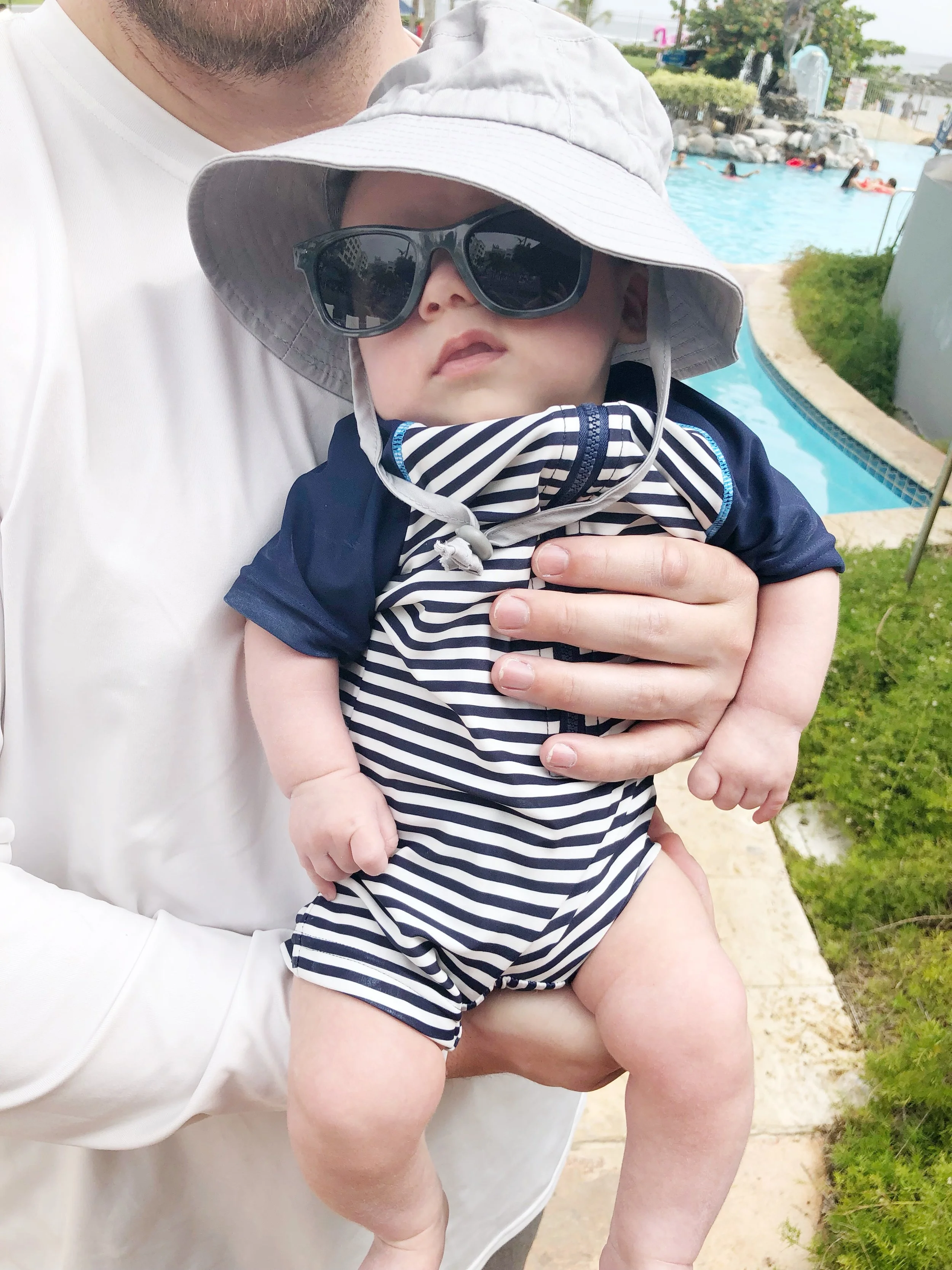 Remy in his sun hat + sunglasses combo.