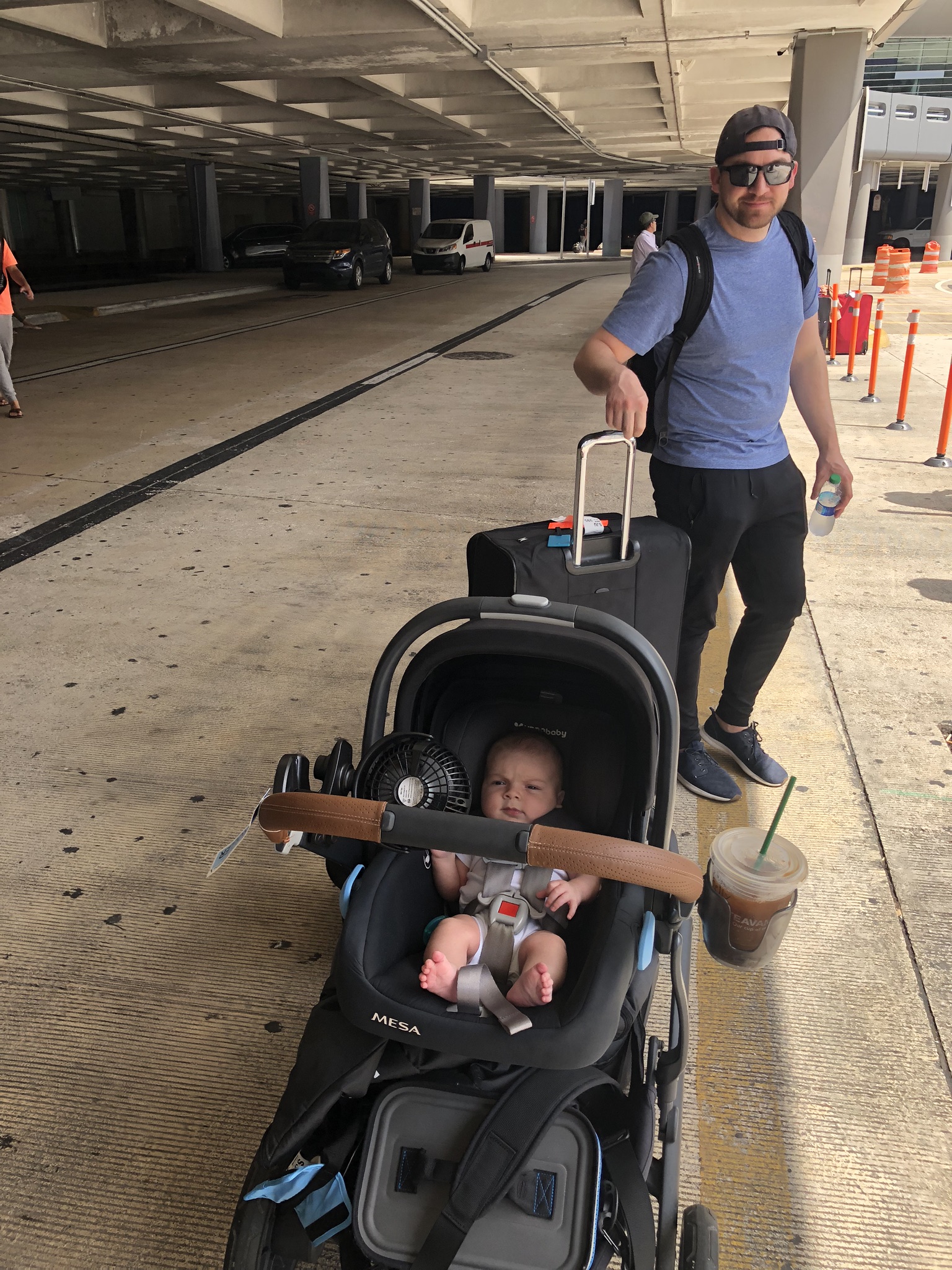 Landing in Puerto Rico. Remy’s stroller decked out with all of our gear! And an iced coffee, of course.