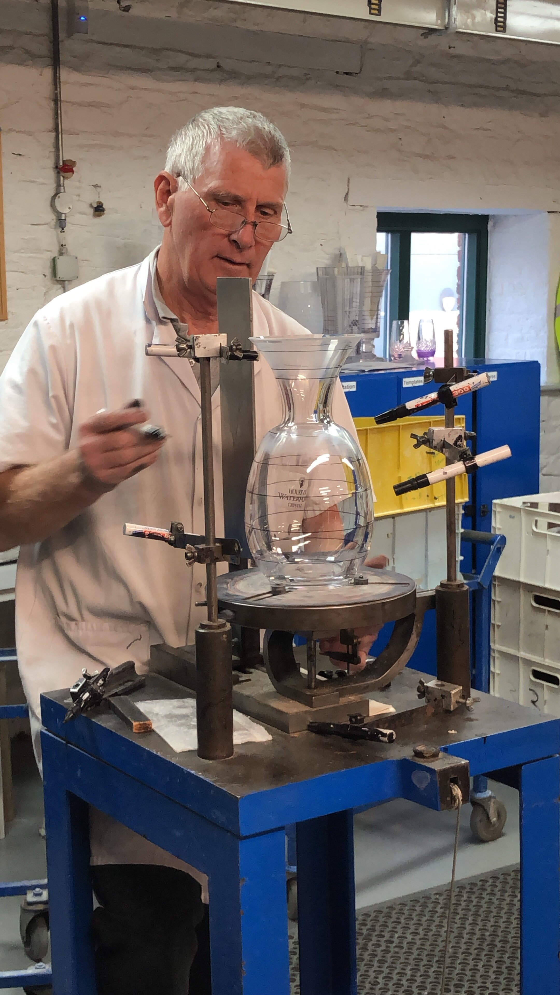Hand-drawing the lines where the crystal will be cut at Waterford Factory.