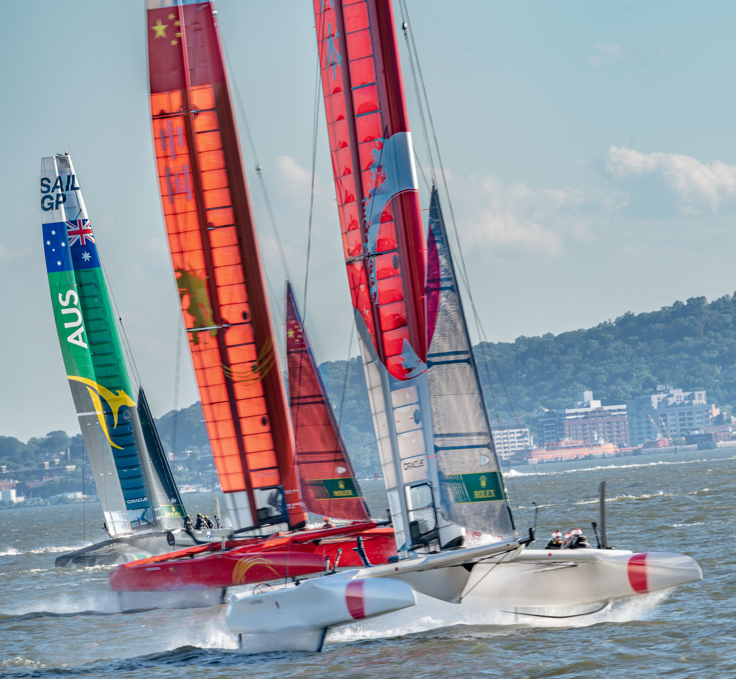 Battling for the lead in the Sail GP race on the Hudson.,  the cats are all riding on hydrofoils..jpg